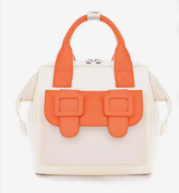 Compact Everyday Design | Spacious Main Compartment | Premium Oxford Fabric | Convertible Carrying Style | Ergonomic Shoulder Straps | Quick-Access Front Pocket | Compact Yet Functional | Minimalist Colourblocked Design | Lightweight & Travel Ready | Perfect for Everyday Use